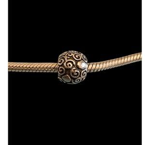 Authentic Pandora stirling silver swirl and dot retired charm